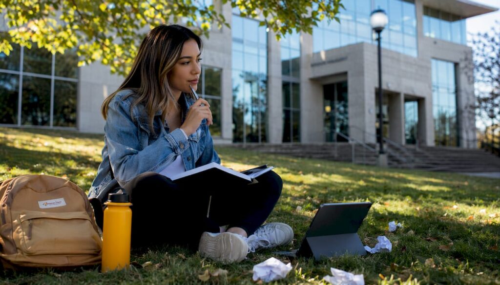Student choosing HyFlex attendance mode outdoors