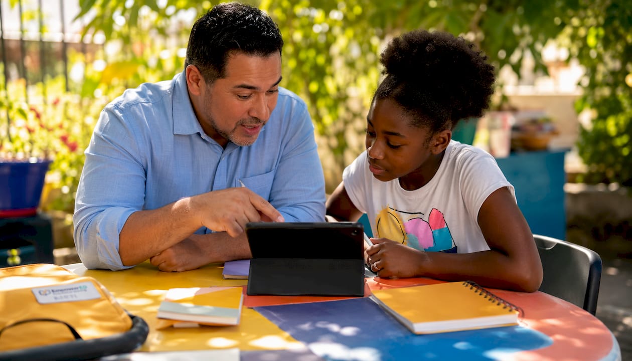 Teacher guiding student with digital formative assessment